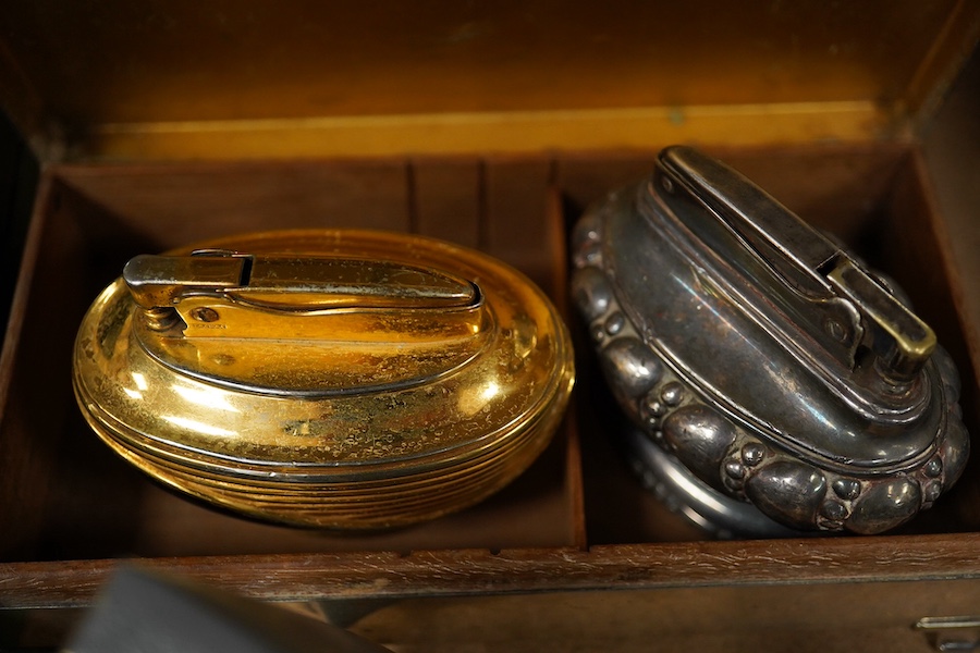 Smoking items; silver cigarette box, three various Ronson lighters and three cigar cutters. Condition - fair